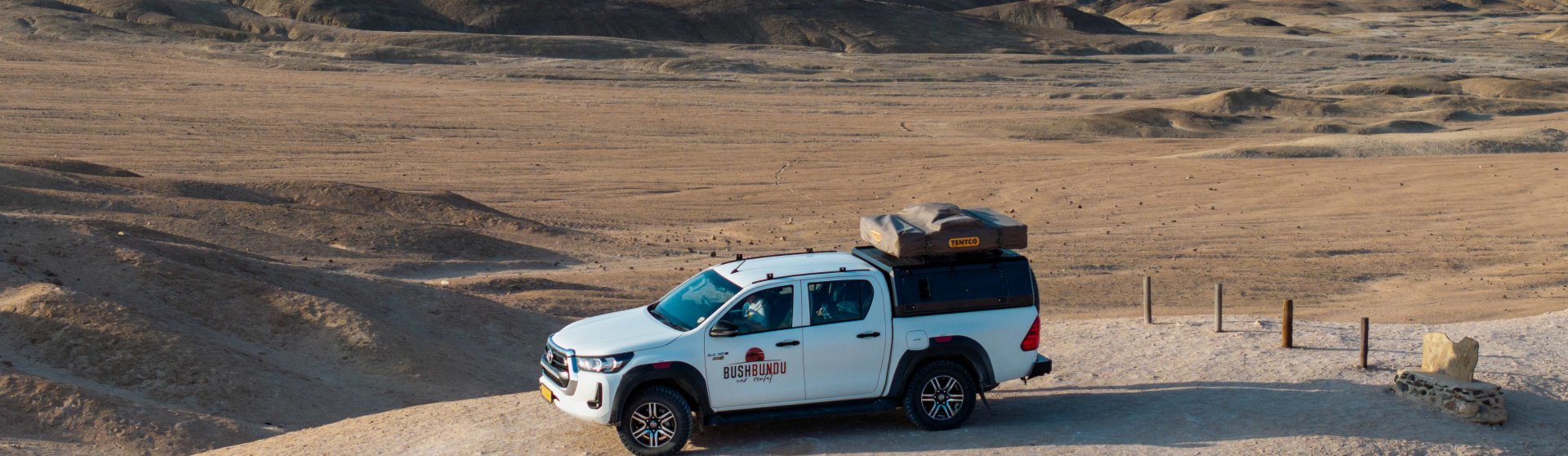 bushbundu-car-rental-windhoek-namibia-image-of-rock-sculpture-in-the-desert-faq-page-cover-image