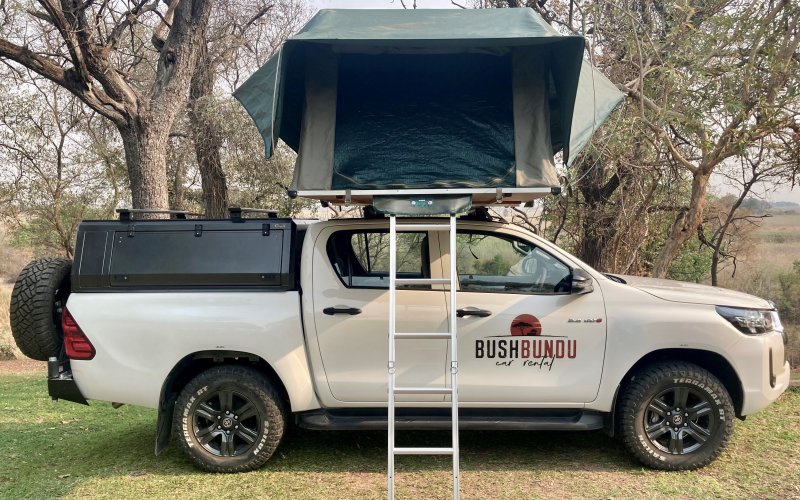 bushbundu-car-rental-windhoek-namibia-side-image-of-a-pitched-tent-on-the-roof-of-toyota-hiilux
