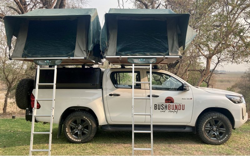 bushbundu-car-rental-windhoek-namibia-side-image-of-two-pitched-tents-on-the-roof-of-toyota-hiilux