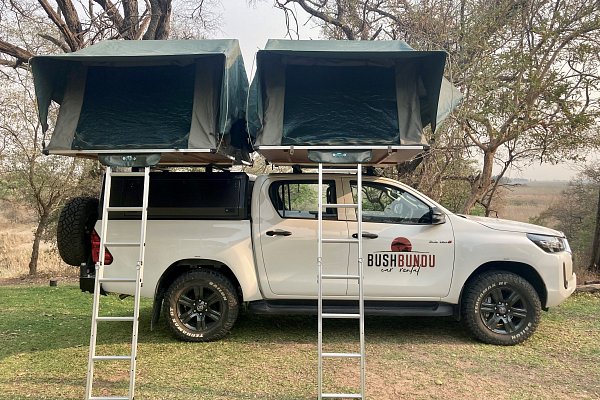 bushbundu-car-rental-windhoek-namibia-toyota-hilux-with-pitched-rooftop-tents-camping-vehicle-for-3-4